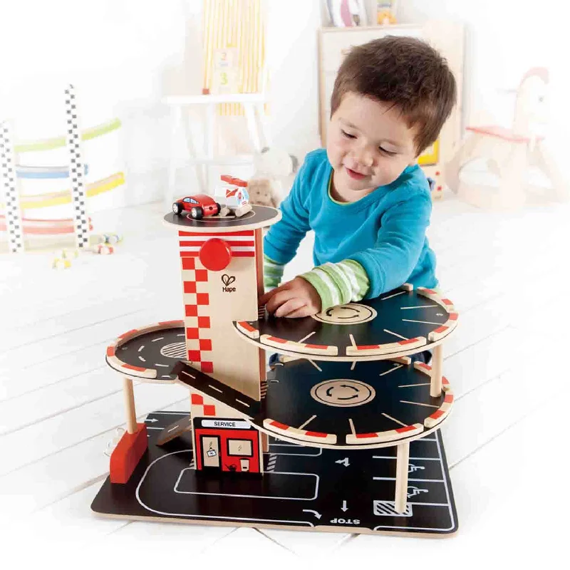 intricately carved wooden toys                   Hape Park and Go Garage