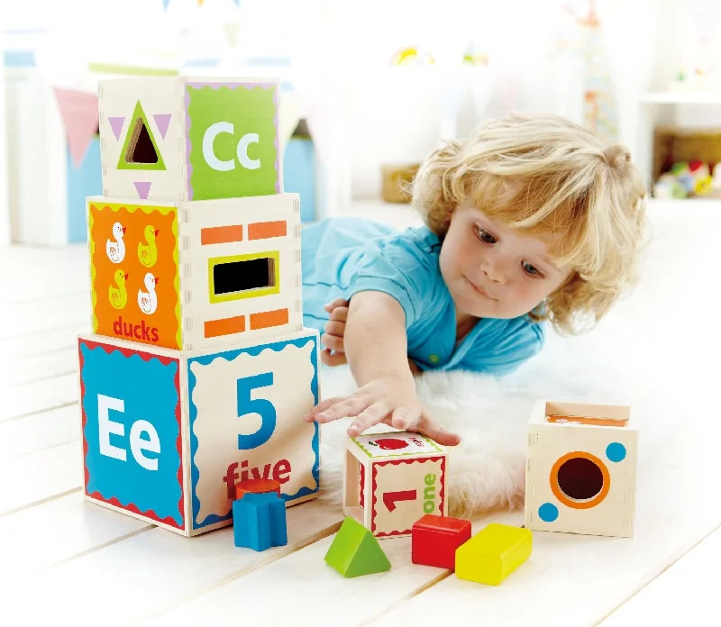intricately carved wooden toys                   Pyramid of play by Hape
